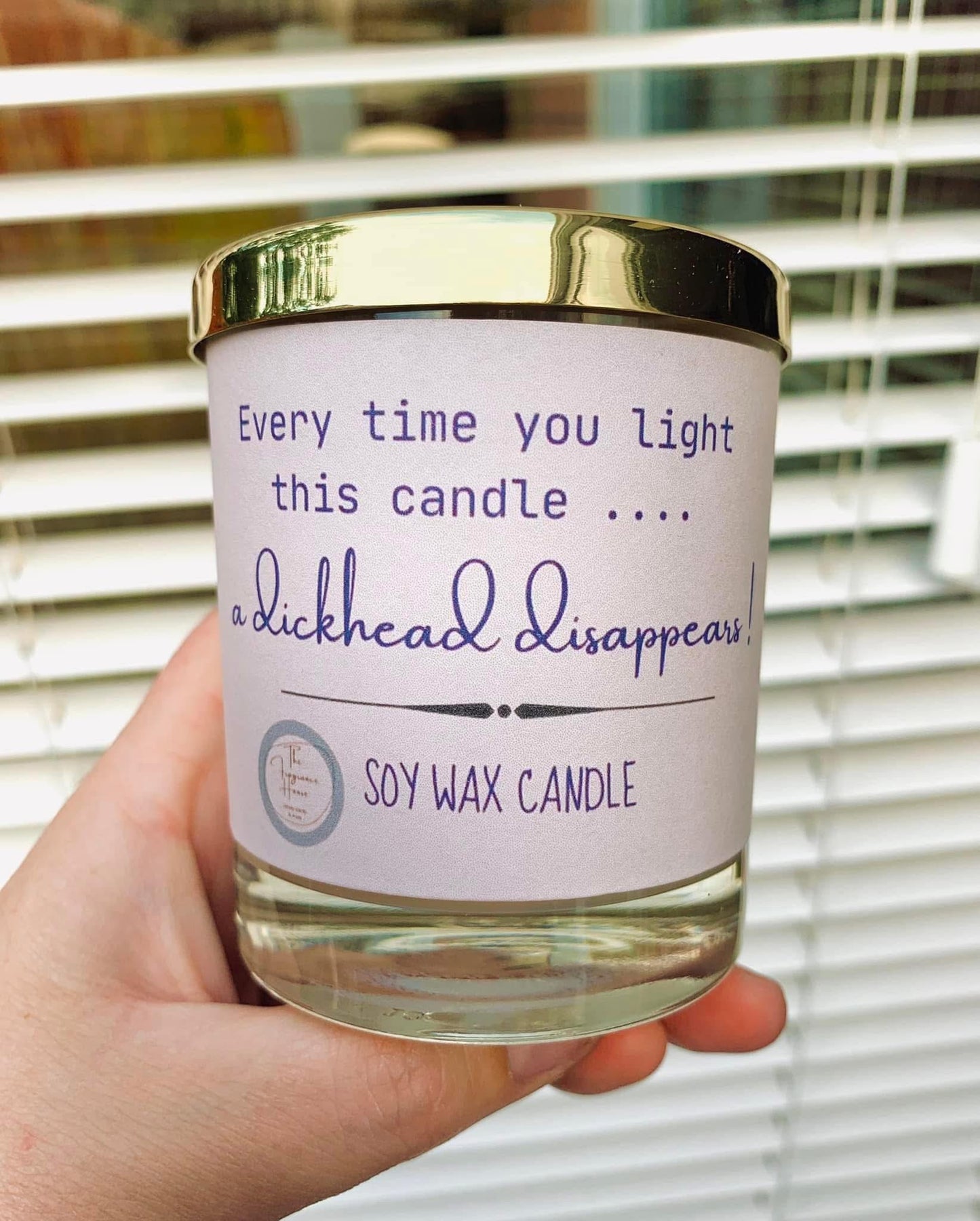 ‘A dickhead disappears’ candle