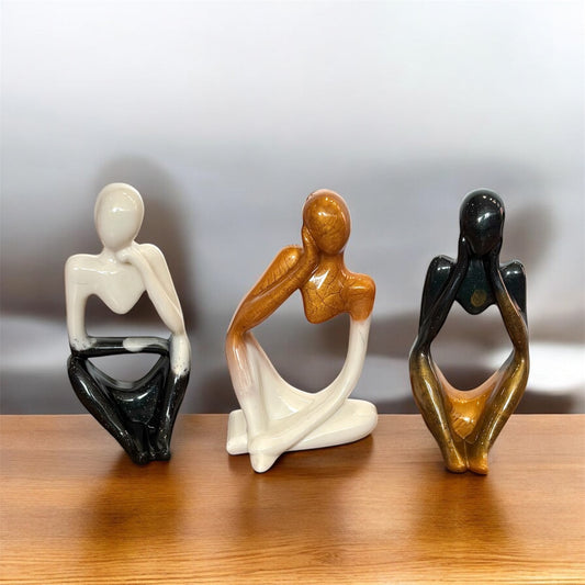 Set of three resin figurines